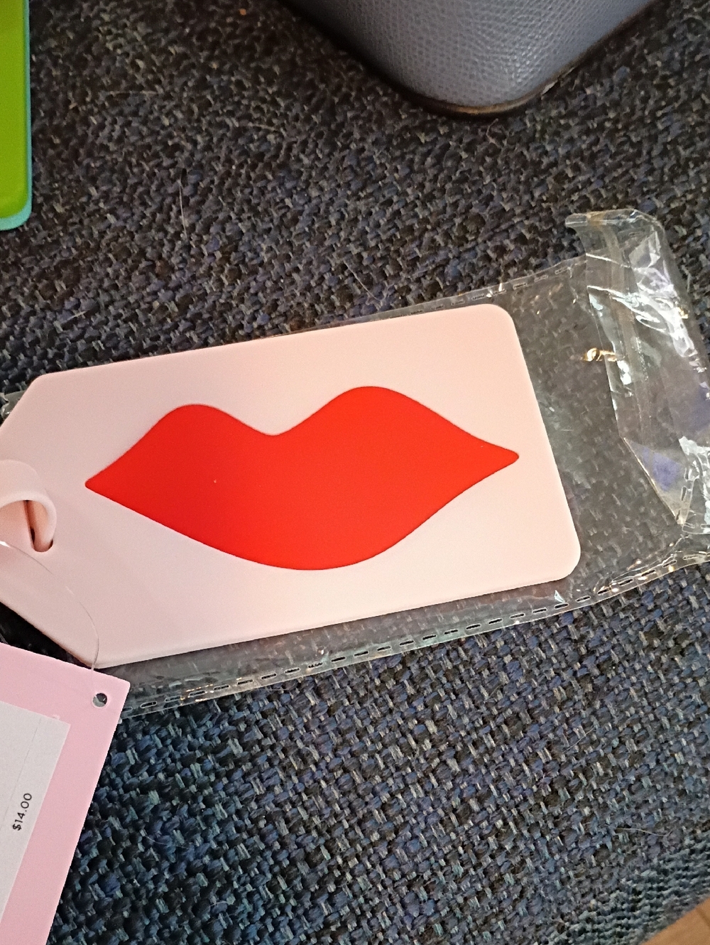 Kate Spade pale pink luggage tag with white ID panel